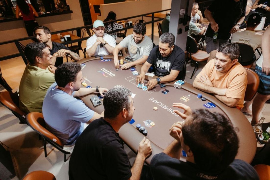 Guests seated around the main card table during a game round